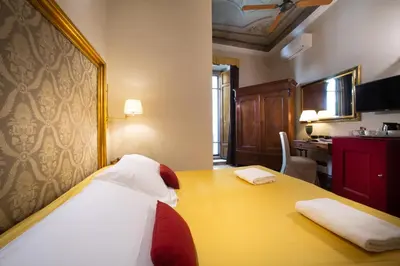 Letto o letti in una camera di Boutique B&B Torre de' Conti