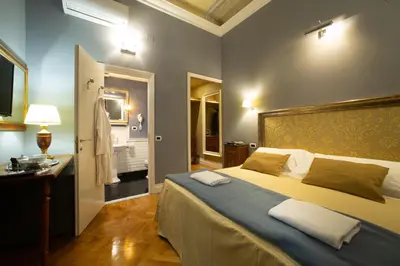 Letto o letti in una camera di Boutique B&B Torre de' Conti