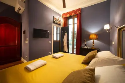 Letto o letti in una camera di Boutique B&B Torre de' Conti