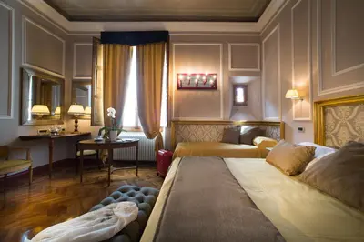 Letto o letti in una camera di Boutique B&B Torre de' Conti