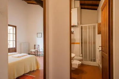 Letto o letti in una camera di Borgo Bottaia