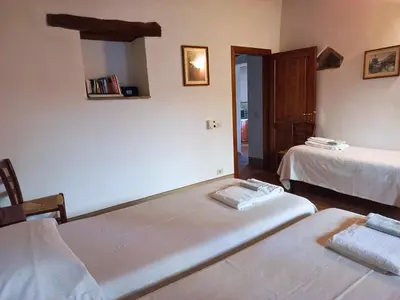 Letto o letti in una camera di Borgo Bottaia