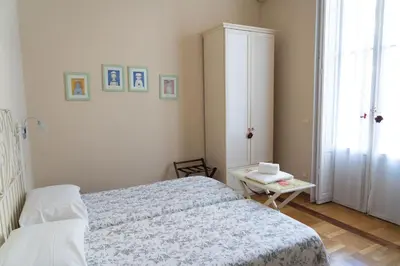 Letto o letti in una camera di Relais Accademia