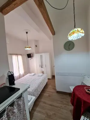 Letto o letti in una camera di Vista su Palazzo Vecchio