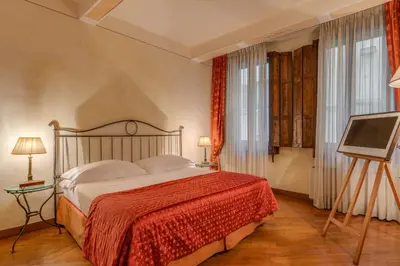 Letto o letti in una camera di Residenza D'Epoca In Piazza della Signoria
