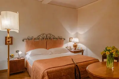 Letto o letti in una camera di Residenza D'Epoca In Piazza della Signoria