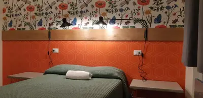 Letto o letti in una camera di Ostello Tasso