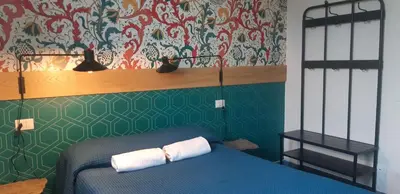 Letto o letti in una camera di Ostello Tasso