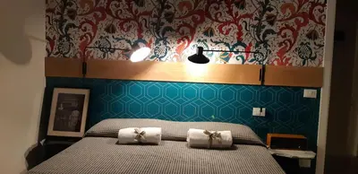 Letto o letti in una camera di Ostello Tasso