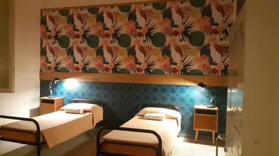 Letto o letti in una camera di Ostello Tasso