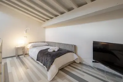 Letto o letti in una camera di Carapelli Apartments