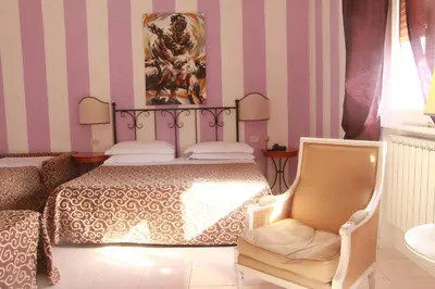 Letto o letti in una camera di Hotel Alex