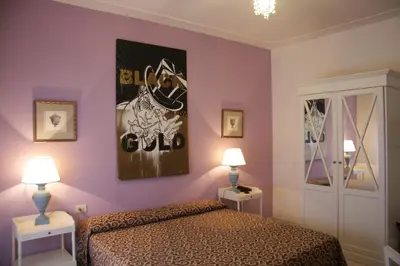 Letto o letti in una camera di Hotel Alex