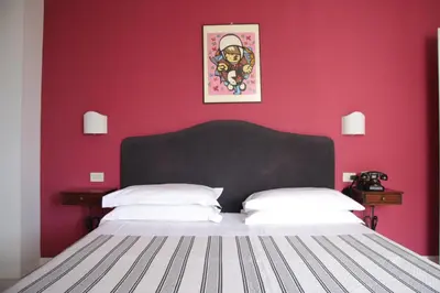 Letto o letti in una camera di Hotel Alex
