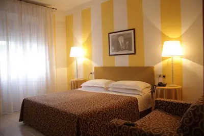 Letto o letti in una camera di Hotel Alex