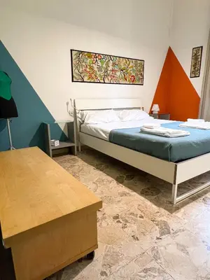 Letto o letti in una camera di Leopoldini Appartamenti