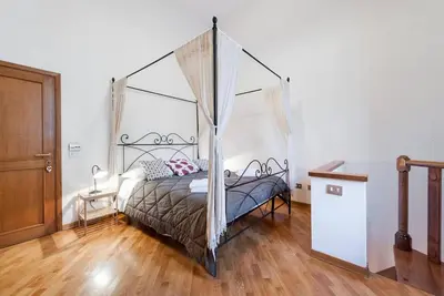 Letto o letti in una camera di Leopoldini Appartamenti