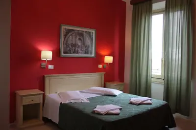Letto o letti in una camera di Hotel Genzianella