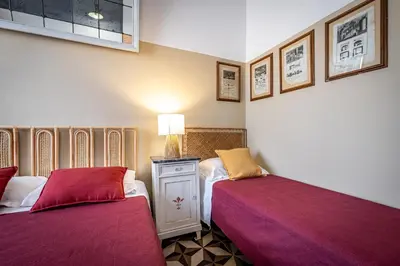 Letto o letti in una camera di Il Magnifico Firenze