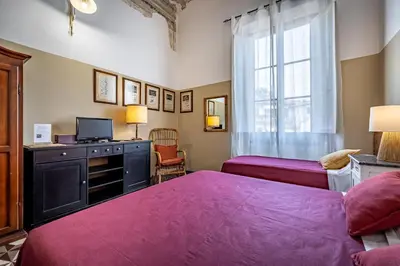 Letto o letti in una camera di Il Magnifico Firenze