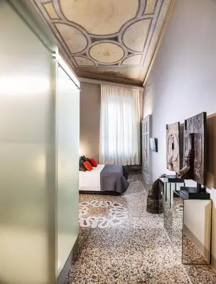 Letto o letti in una camera di Casa Botticelli