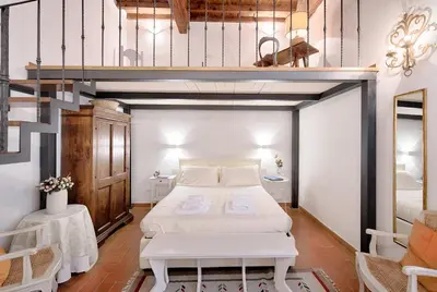 Letto o letti in una camera di Corte al Duomo by Mmega