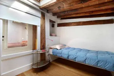 Letto o letti in una camera di Appartamento In Via Giuseppe Verdi