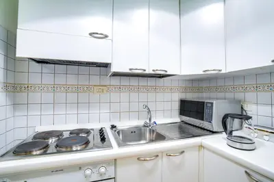 Cucina o angolo cottura di Palazzo Spinelli Apartment by Mamo Florence