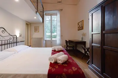 Letto o letti in una camera di Piazza Dei Ciompi With Private Garden