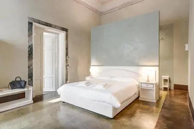 Letto o letti in una camera di Palazzo D'Oltrarno - Residenza D'Epoca