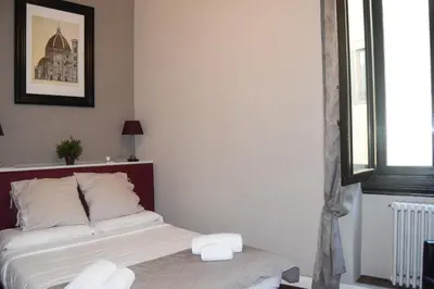 Letto o letti in una camera di Soggiorno La Cupola Guesthouse