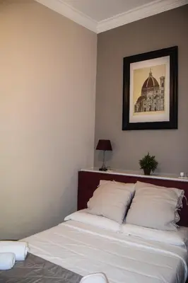Letto o letti in una camera di Soggiorno La Cupola Guesthouse