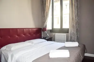 Letto o letti in una camera di Soggiorno La Cupola Guesthouse