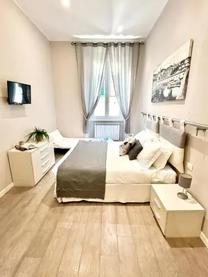 Letto o letti in una camera di Silver Novella Luxury Apartment - Centro Storico