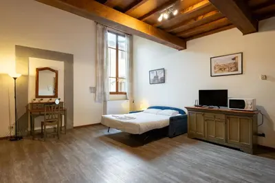 Letto o letti in una camera di Apartments close to Duomo