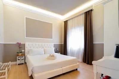 Letto o letti in una camera di Residenza D'Epoca La Basilica