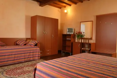 Letto o letti in una camera di Il Colombaino