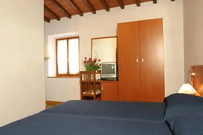 Letto o letti in una camera di Il Colombaino