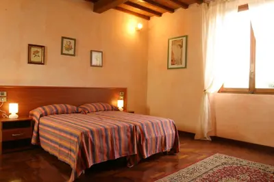 Letto o letti in una camera di Il Colombaino