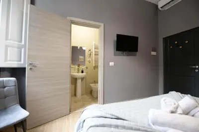 Letto o letti in una camera di Palazzo Oliveto