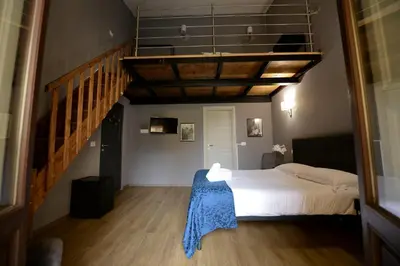 Letto o letti in una camera di Palazzo Oliveto