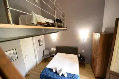 Letto o letti in una camera di Palazzo Oliveto