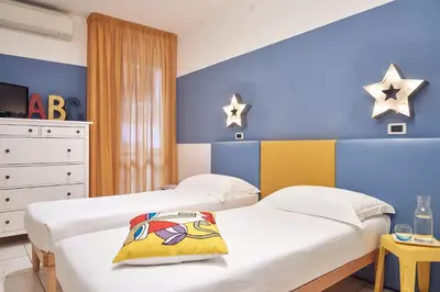 Letto o letti in una camera di Residence Leopoldo