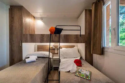 Letto o letti in una camera di Camping Village Il Poggetto