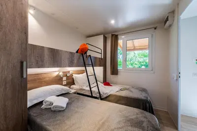 Letto o letti in una camera di Camping Village Il Poggetto