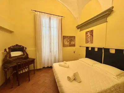 Letto o letti in una camera di Loft Vivi il Cuore di Firenze