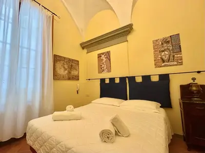Letto o letti in una camera di Loft Vivi il Cuore di Firenze