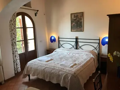 Letto o letti in una camera di B&B La Fonte del Machiavelli