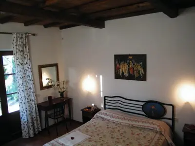 Letto o letti in una camera di B&B La Fonte del Machiavelli