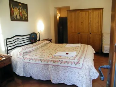 Letto o letti in una camera di B&B La Fonte del Machiavelli